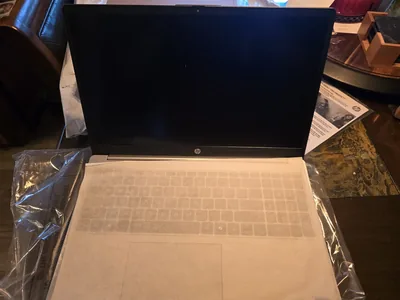 New laptop unboxed and prepared before handover