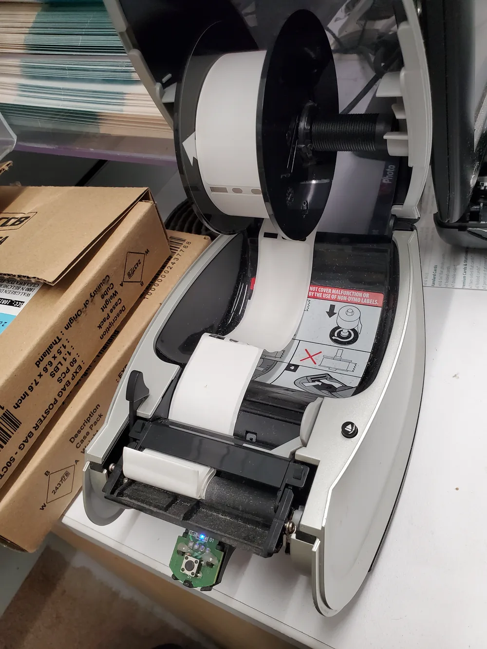 Thermal label printer opened with a label roll fitted