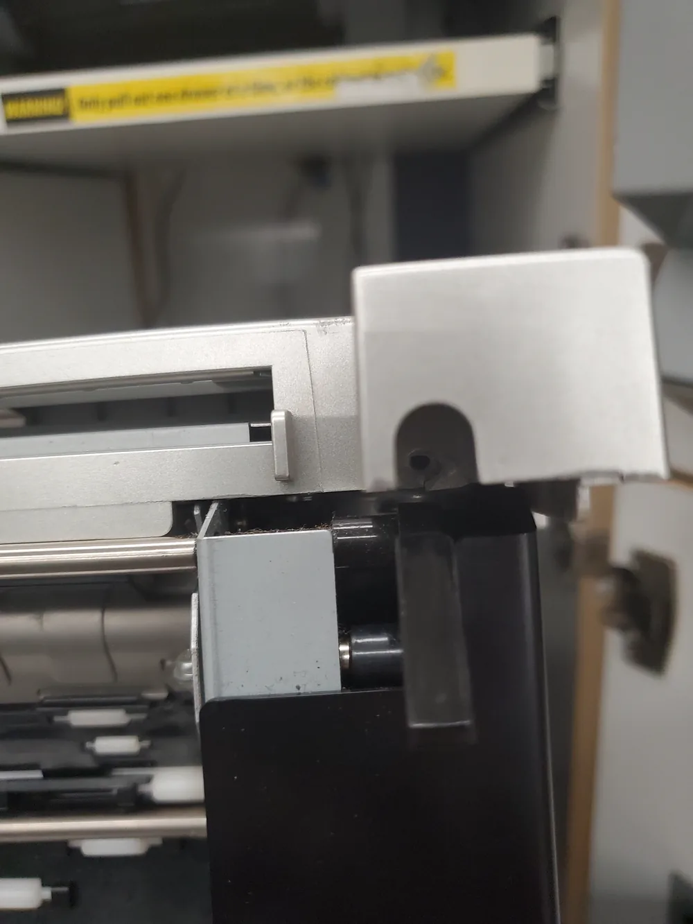 Dye-sublimation photo printer opened, showing the transport rollers