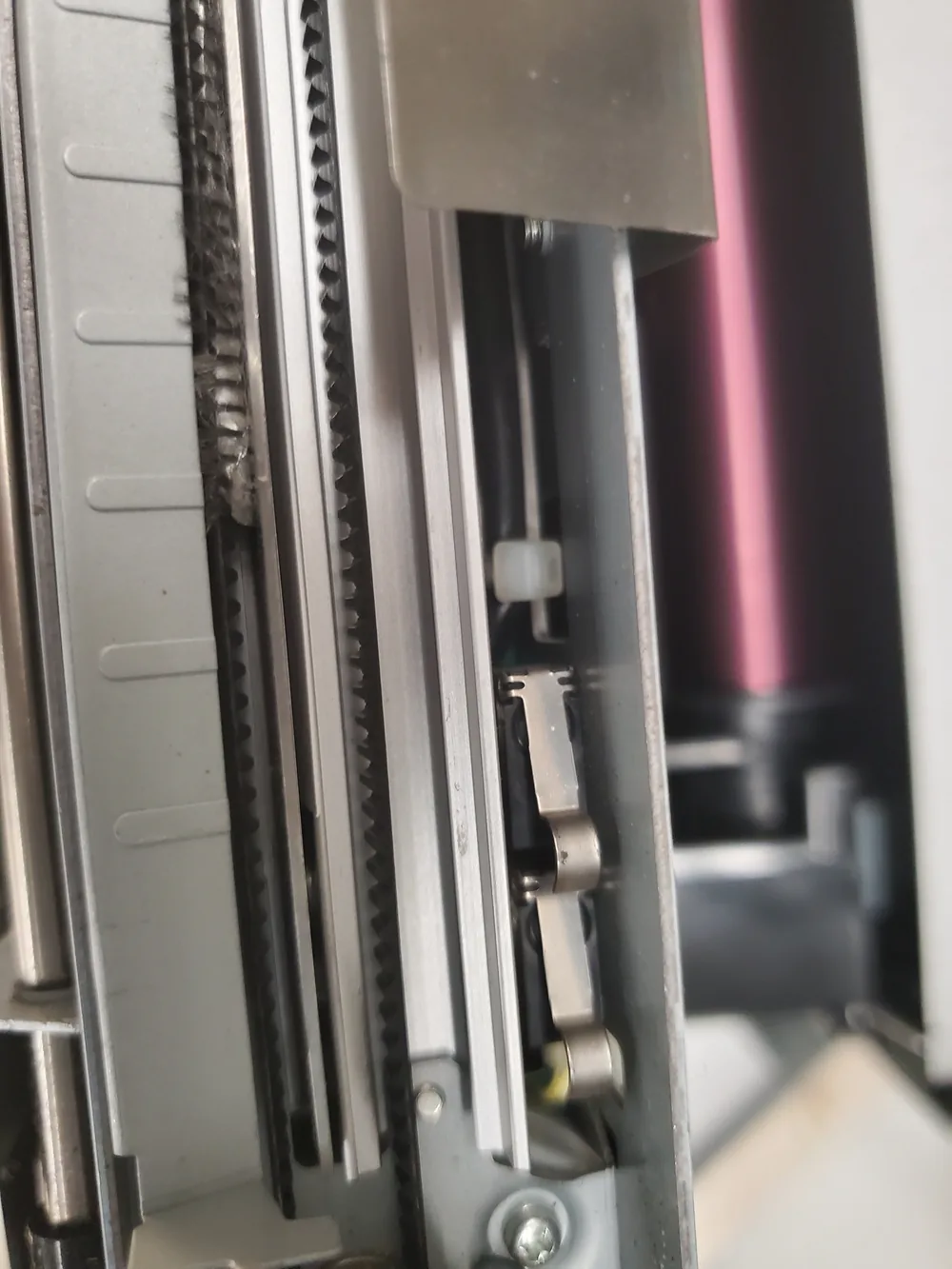 Ribbon path and drive belt inside a dye-sublimation printer