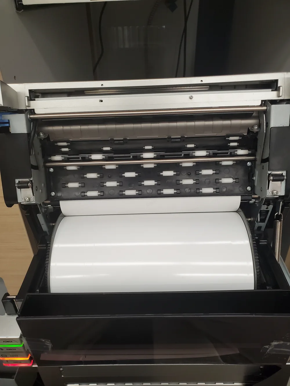 Paper roll loaded into a dye-sublimation photo printer