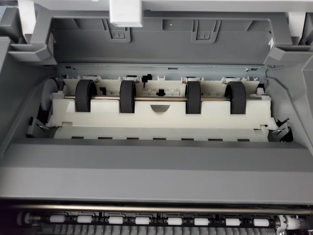 Pickup rollers and paper path exposed on an inkjet printer